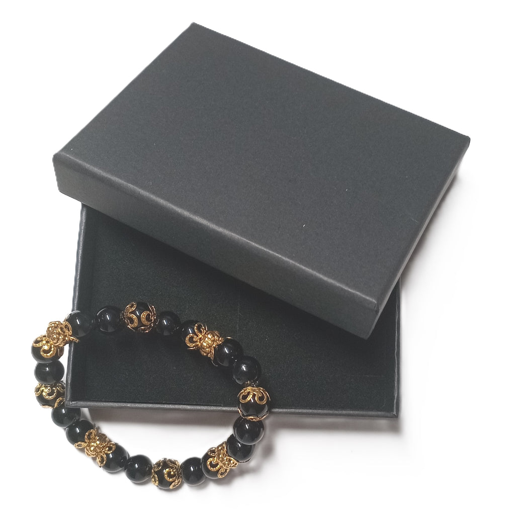Onyx Armband in schwarz mit goldenen Perlkappen und Goldperlen